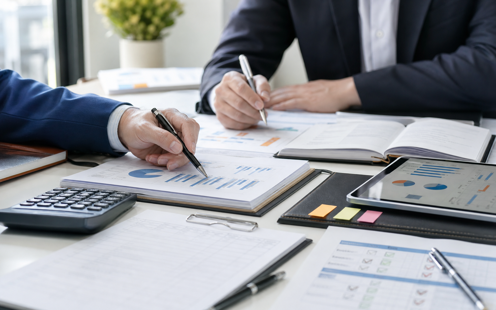 Accounting professionals reviewing advisory documents